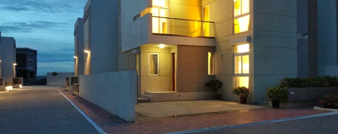 A completed Aurum Villas home at dusk – earlier phase, actual photograph